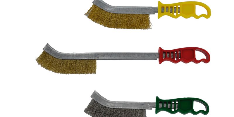 How do you properly remove paint from a metal surface before repainting?