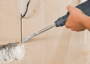 How do you make a groove in a concrete wall ?